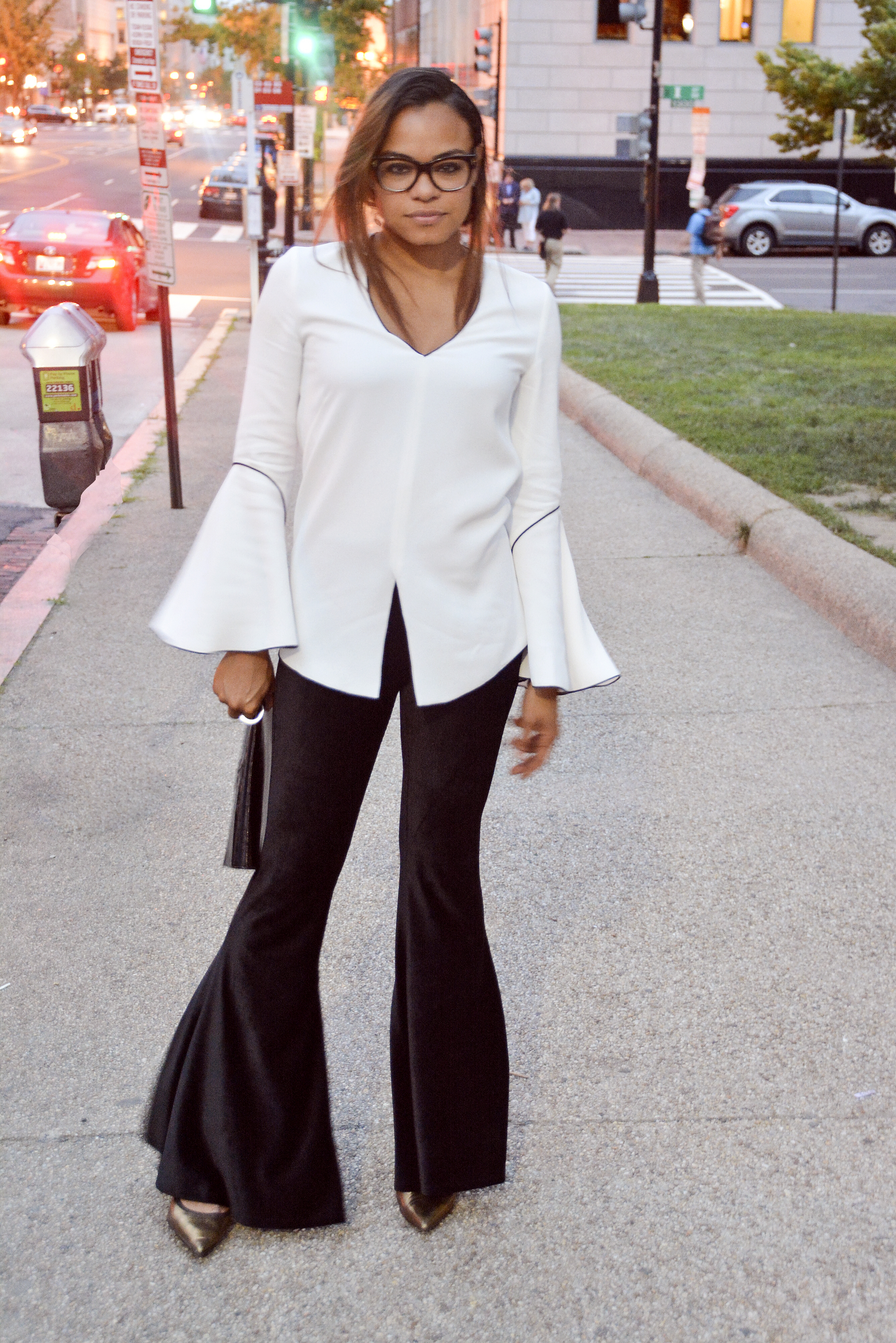 wearing: H&amp;M pants, Derek Lam top, Giuseppe Zanotti heels, Tom Ford eyeglasses.&nbsp;