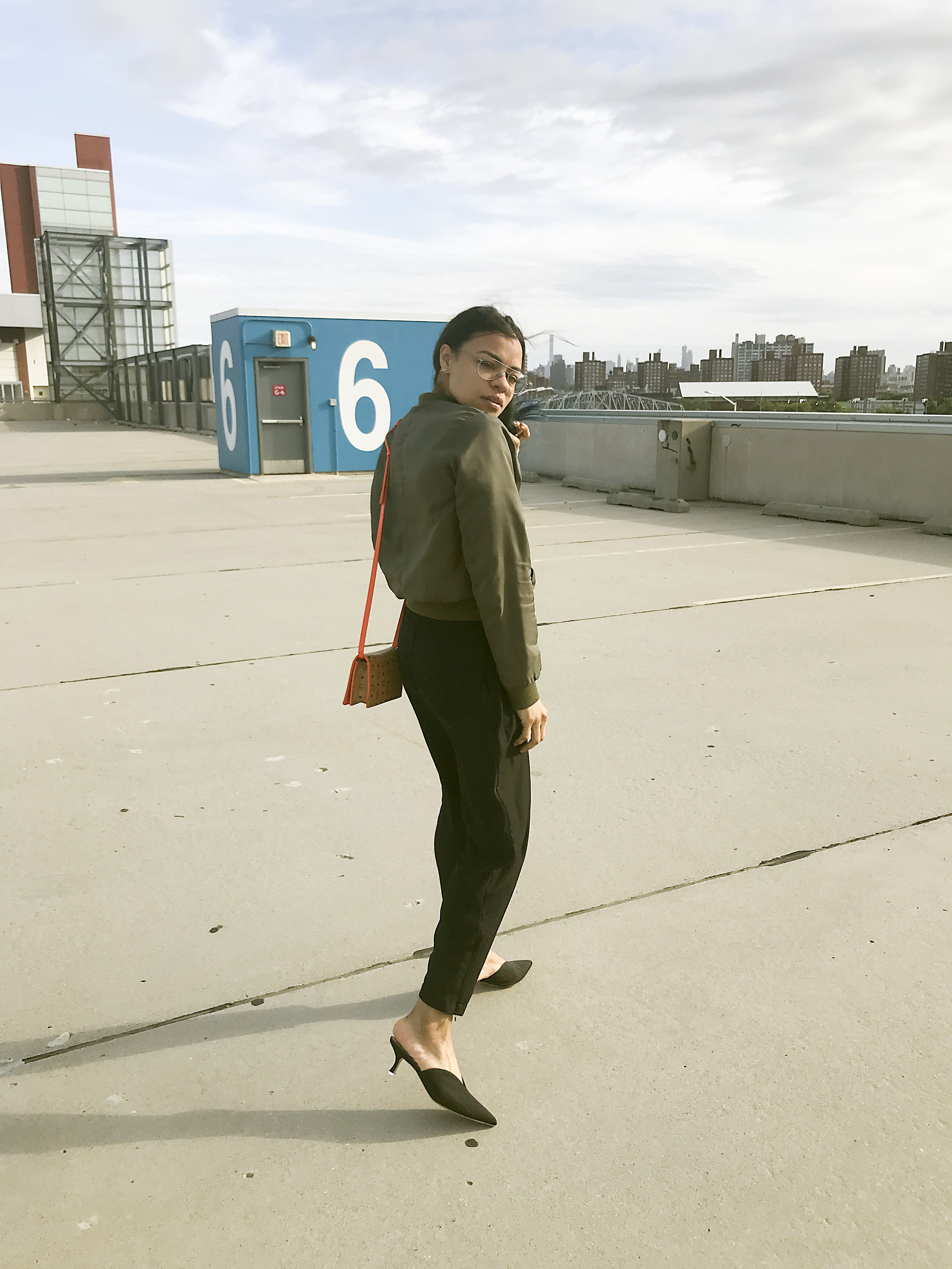 Tee: Tibi. Pant: Urban Outfitters. Shoes: Attico. Jacket: no brand. Eyeglasses: Porche Design &nbsp;Bag: MCM