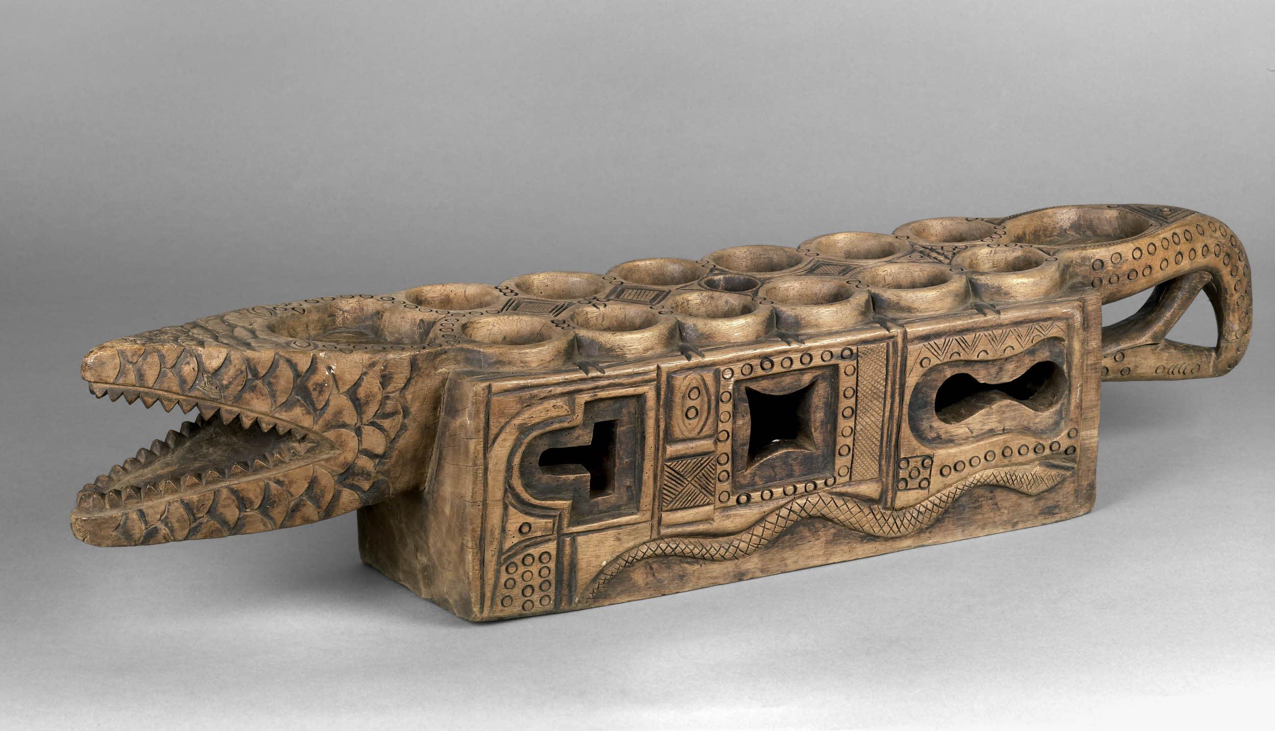 An Ekoi (Nigerian) board made out of wood and tin. Photo by: British Museum.