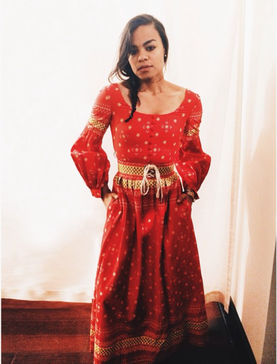 wearing: Oscar de la Renta dress