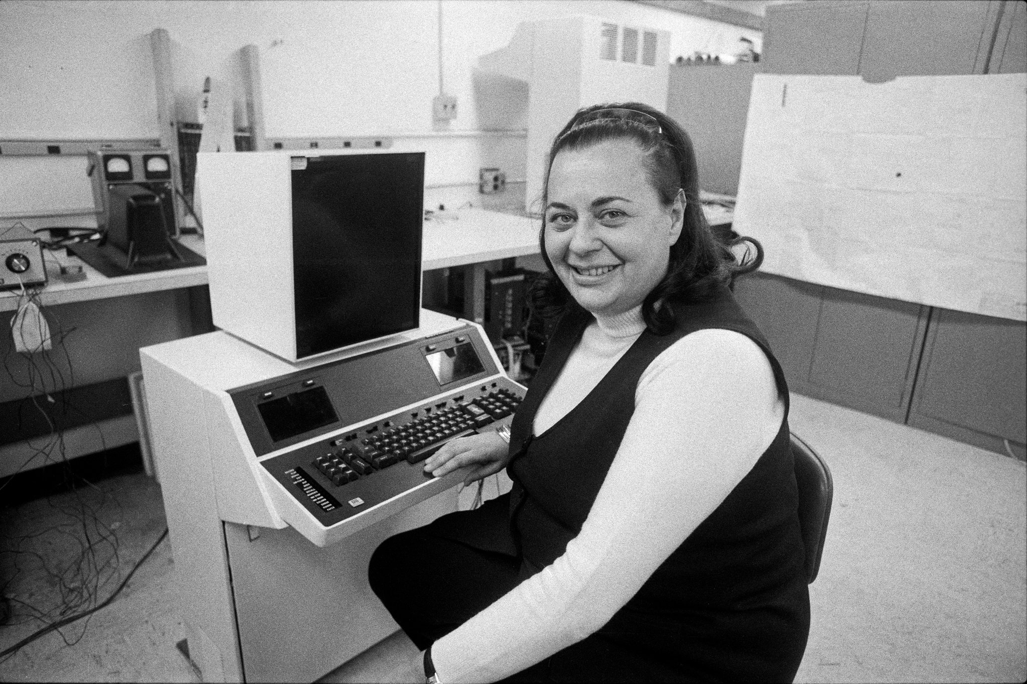 Evelyn Berezin in 1976, when she was president of the Redactron Corporation, with Data Secretary, the first computerized word processor, which she designed and marketed.CreditBarton Silverman/The New York Times